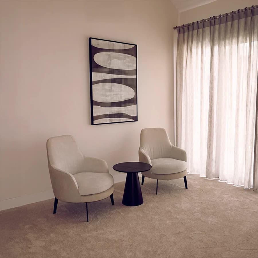 A room with two chairs and a table